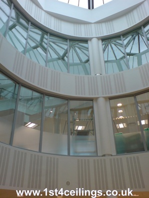 3 floor atrium with circular acoustic bulkheads and segmented glazed screens